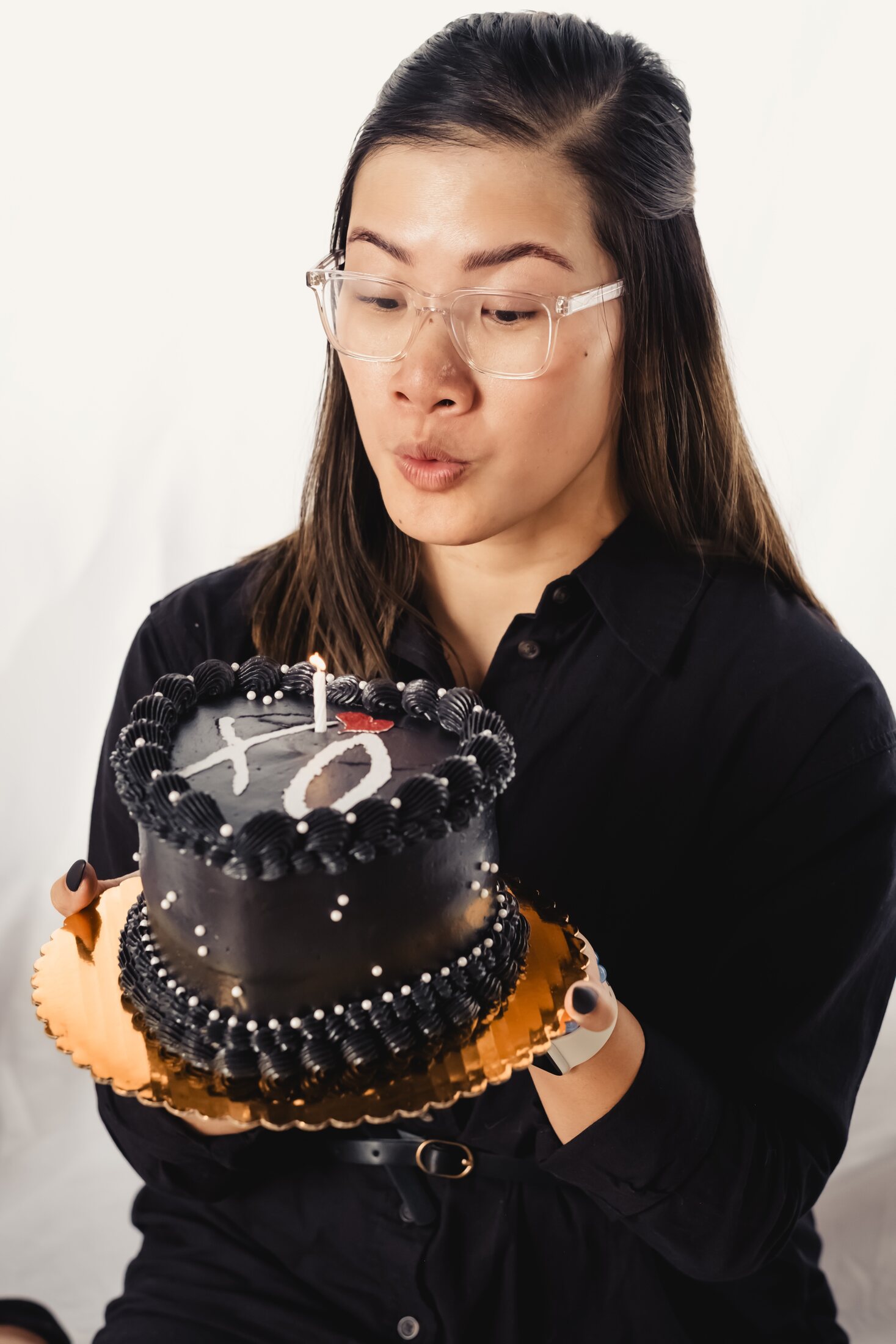 Lifestyle portrait holding cake