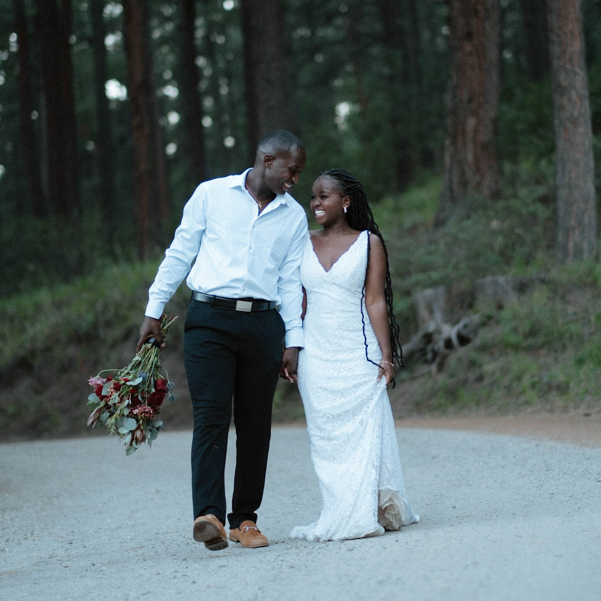 Couple walking through forest